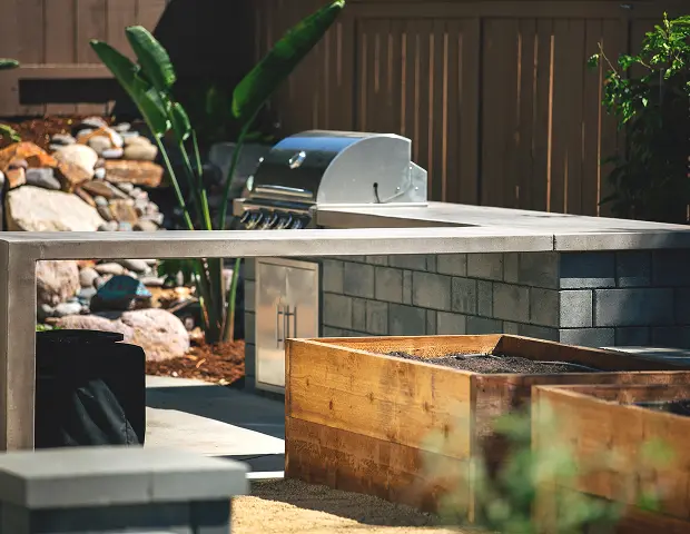 An outdoor kitchen setup with a bbq
