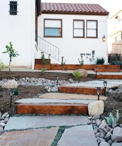 Artisanal stonework surrounded by lush landscaping