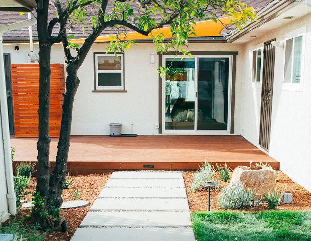 A deck with stepping stones leading up to it