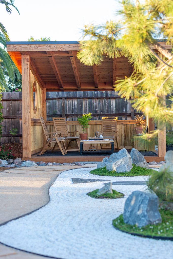Teahouse and gravel courtyard seen from the garden path