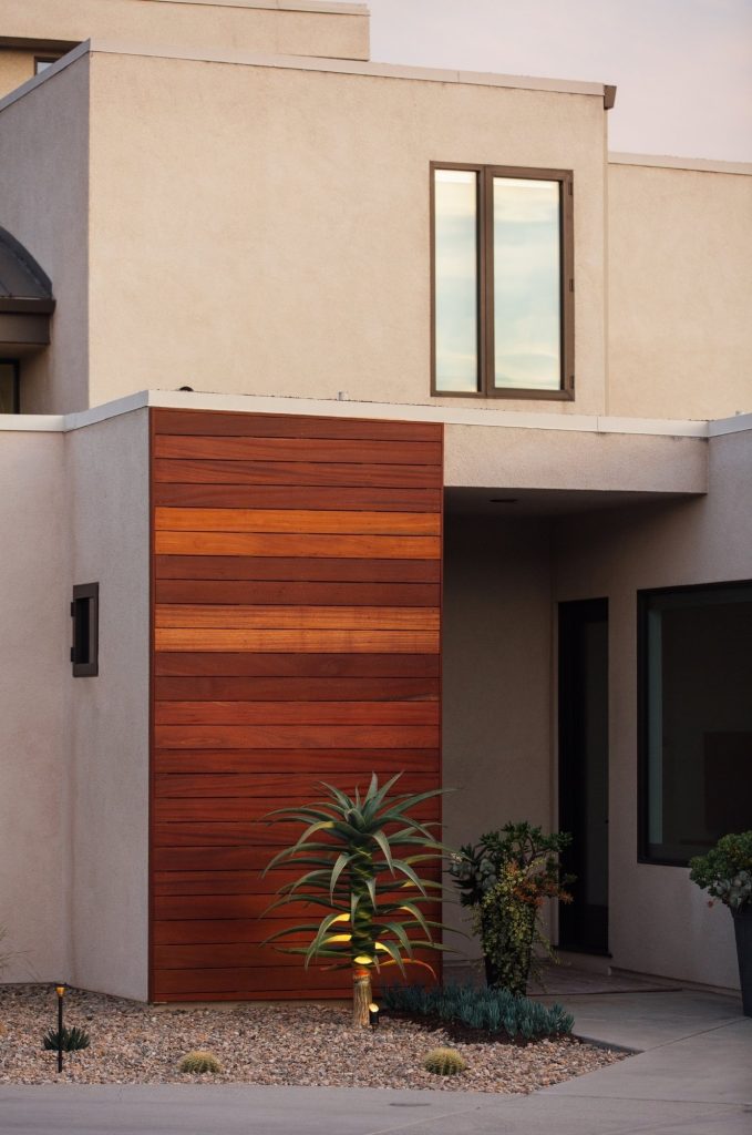 Modern front yard entry with wood accent wall