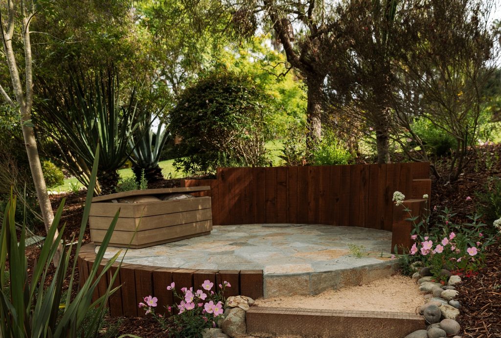 Flagstone patio, timber retaining wall