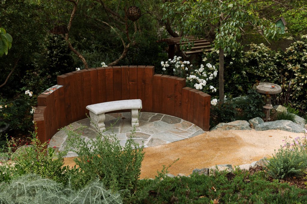 timber edge wall and flagstone patio